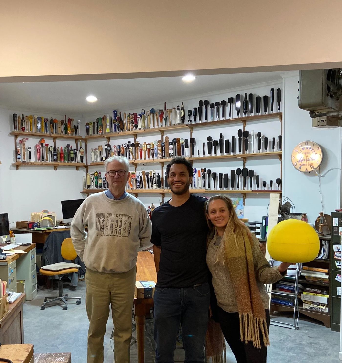 Maelis, Marcus, and Mark Supik in the Baltimore woodturning shop where the first BOUNCE ball was made